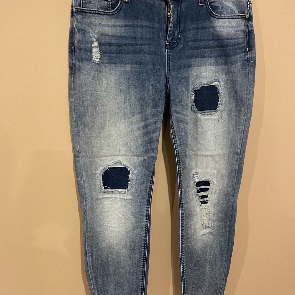 Hippie Laundry size 32 distressed blue jeans with district ripped spaces